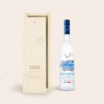Grey Goose vodka bottle next to an engraved wooden case with the text Eden and Happy Birthday