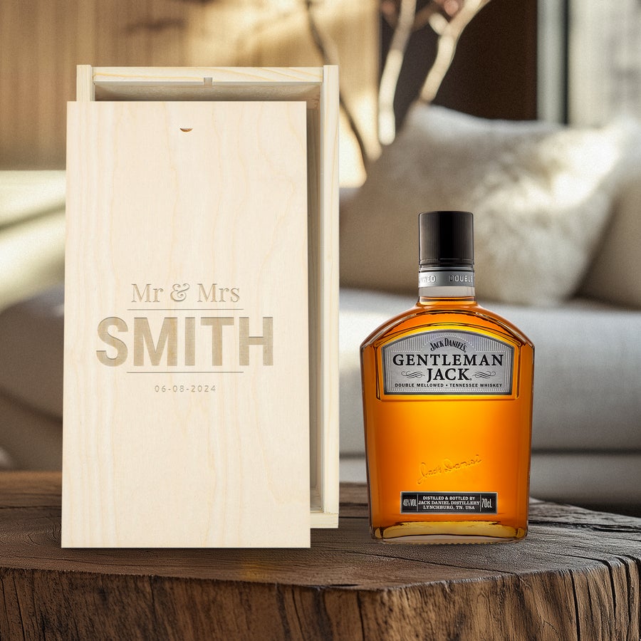 Gentleman Jack whisky bottle next to an engraved wooden case with Mr & Mrs Smith and 06-08-2024
