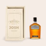 Engraved wooden case with a bottle of Gentleman Jack whisky. The case lid is laser-engraved with the name Josh.