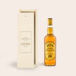 Glen Talloch whisky bottle next to an engraved wooden case with the name Josh
