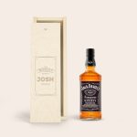 Bottle of Jack Daniels whisky and a personalized wooden case engraved with "This whisky belongs to Josh"