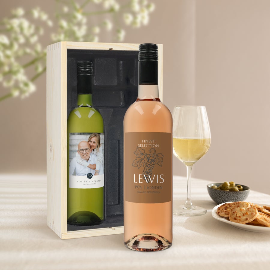 Two personalized Belvy white and rosé wine bottles with custom printed labels in a wooden gift box