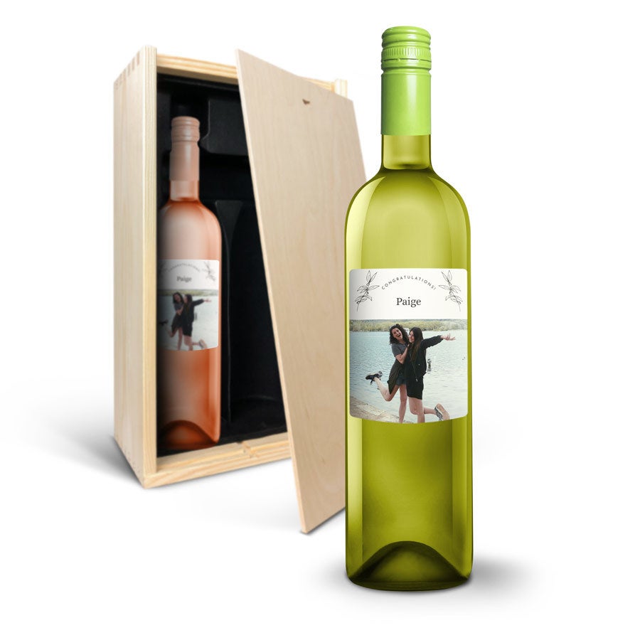 Two wine bottles in a wooden gift box, one white and one rose, with a personal label featuring a photo of two women and the name Paige to surprise someone.