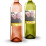 Two bottles of oude kaap wine with a personal label featuring a photo and the word Thanks