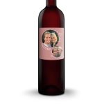 Bottle of red wine with a personalized pink label printed with photos and the text Thanks.