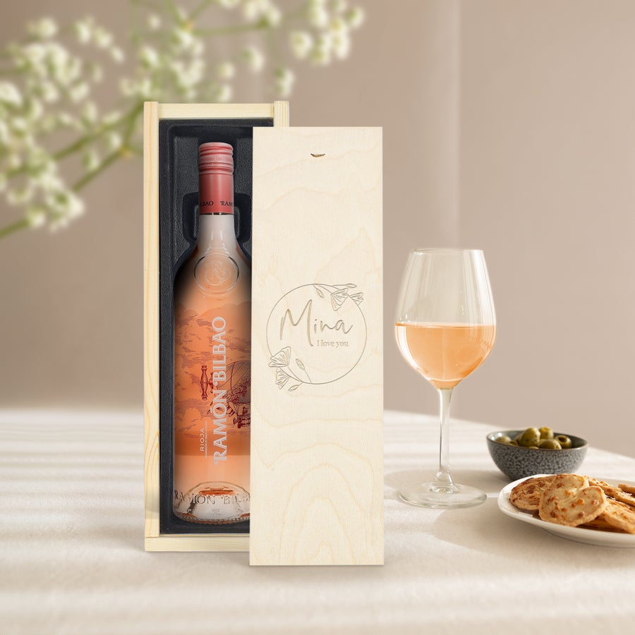 A bottle of Ramon Bilbao rosé in an engraved wooden case with the name Mina and I love you