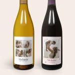 Two salentein wine bottles with personalized photo labels, one white wine and one red wine, each with "Melanie" printed on the label
