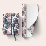 Custom photo printed personalised wrapping paper with a disco ball design and custom text 'Aria 30', tied with a blue ribbon.