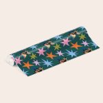 Personalised wrapping paper printed with custom photos in colorful star shapes on a dark green background