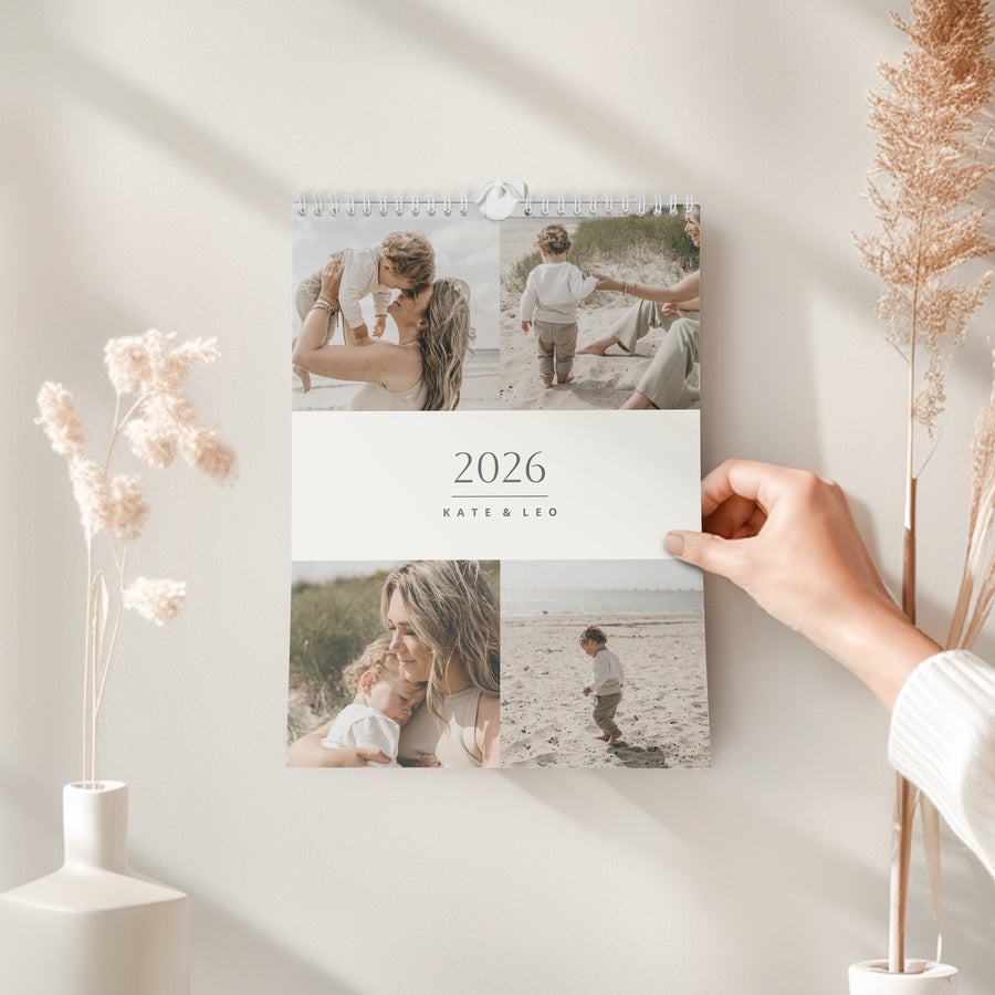2026 personalised calendar printed with a photo collage of a family and the names Kate & Leo
