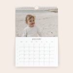 A 2026 personalised calendar with a photo of a baby on the beach printed above the January dates
