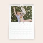2026 personalised calendar with a child playing in flowers photo printed on the January page