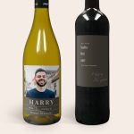 Two Maison de la Surprise wine bottles with personalised labels, one white wine with a photo and the name Harry, and one red wine with the text Suits the age you have become Harry 36 years.