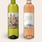 Two personalized wine bottles, a white and a rosé, with custom photo labels for a wine gift set.