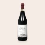 Bottle of red wine with a personalized label that features a vineyard illustration and custom text.