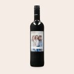 Merlot wine with a personalized label, printed with a photo of three women and the text Cheers to Friendship