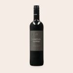 Maison de la Surprise Merlot with a personalized label featuring "Chateau Harris" and an octopus design