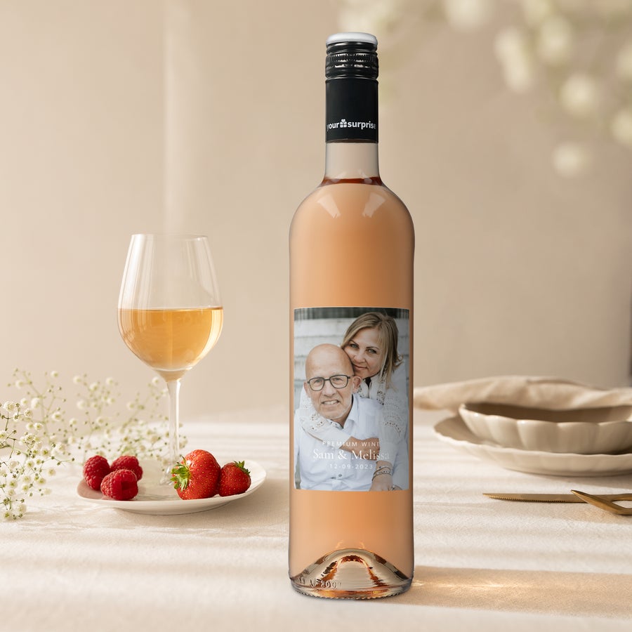 Rose wine bottle with a personalized label, printed with a photo of a couple and the names Sam & Melissa 12.09.2023.