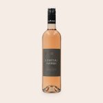 A bottle of Maison de la Surprise Syrah with a custom Chateau Harris label printed with an octopus design.