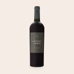 Bottle of Riondo Merlot wine with a personalized label reading Chateau Harris, crafted in England, premium aged.