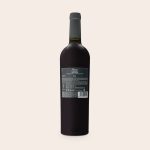 A bottle of Riondo Merlot wine with a plain black label ready for a personalised label.