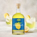 Personalized limoncello bottle with a blue label featuring a lemon design and "Nathan's limoncello" text