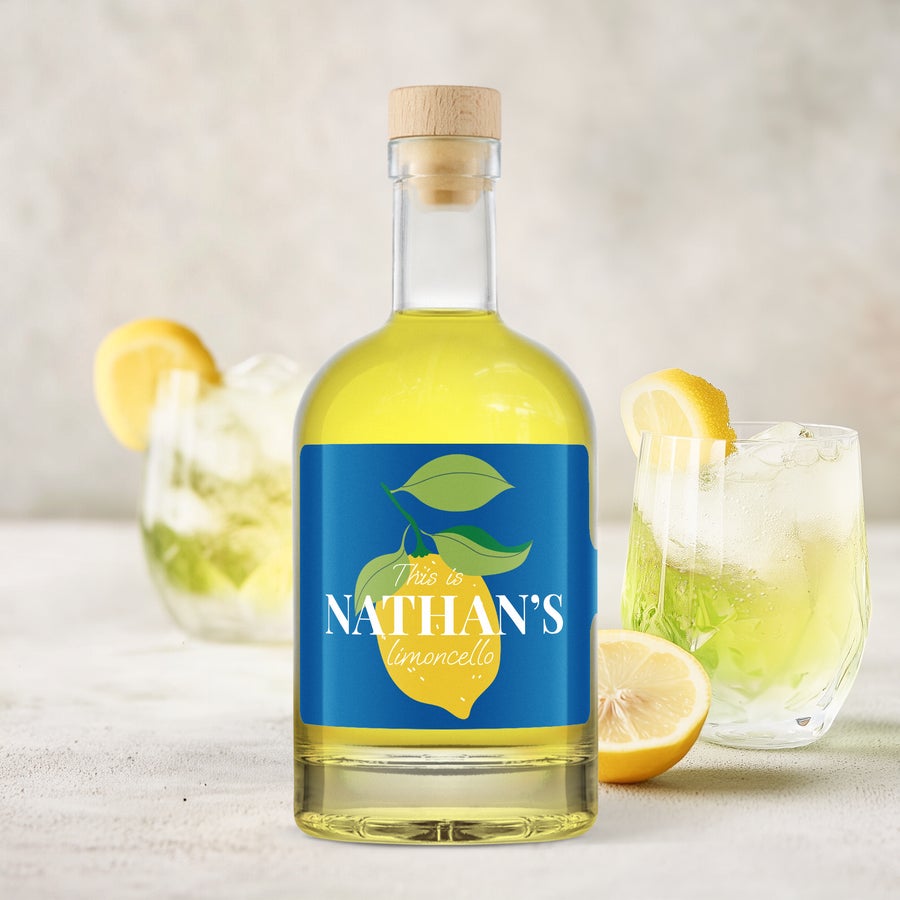Personalized limoncello bottle with a blue label featuring a lemon design and "Nathan's limoncello" text