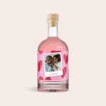 Personalized pink gin with a unique photo label, printed with "I love you" text.