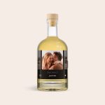 Personalised whisky bottle with a photo of a couple and Happy Birthday Jasper printed on the label